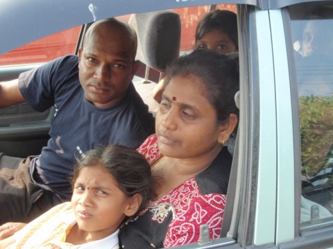 Mohan, who is driving, is the younger brother of the deceased. On his left is the grieving mother of the late Kugan 