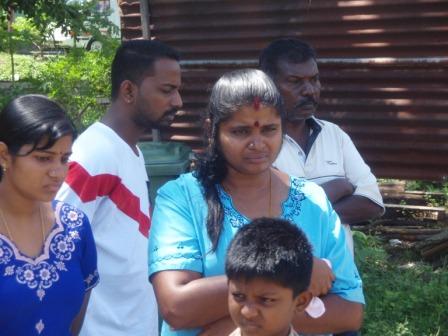 The lady in the light blue dress is Madam Gowri, sister of the late Gunasegaran