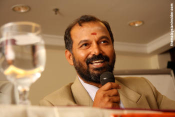 Thanenthiran in his dapper suit, a far cry from his street activism days. Photo courtesy of Malaysianinsider 
