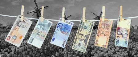 Money laundering concept, banknotes hanging on washing line